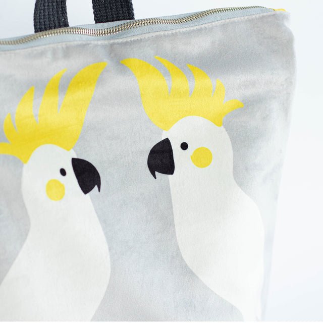 6. Detailed close-up of cockatoo design on Muni Cockatoo backpack in grey velvet
