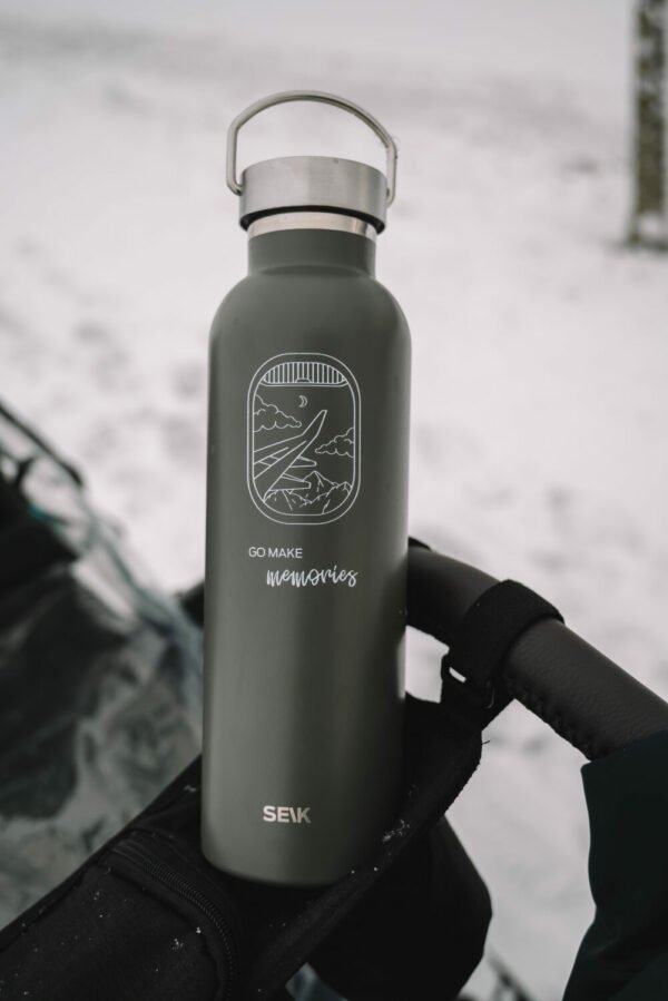 1. SEIK water bottle thermos in green with 'Go Make Some Memories' design, shown outdoors on a snowy day