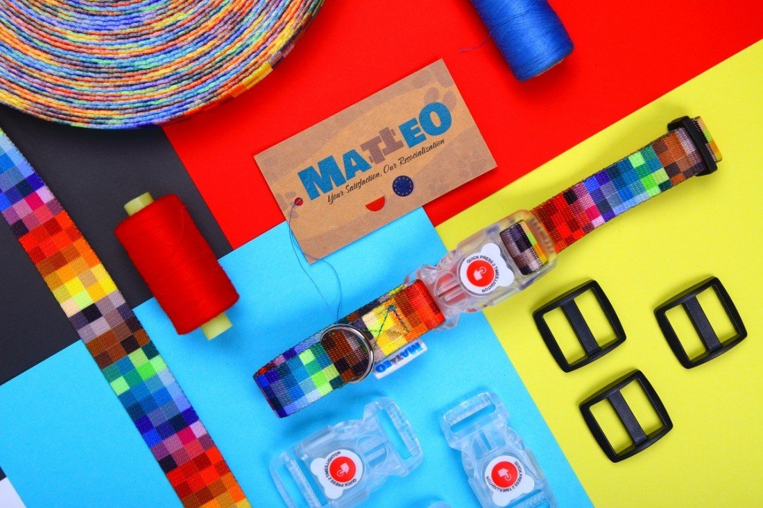 4. Flat lay of colorful pixel-patterned dog collar with LED buckle, sewing threads, and Matteo brand tag