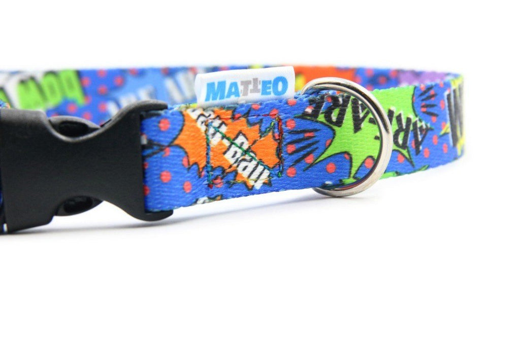 3. Close-up of blue graffiti dog collar with plastic buckle, highlighting Matteo logo and nickel-plated ring on colorful comic-style fabric