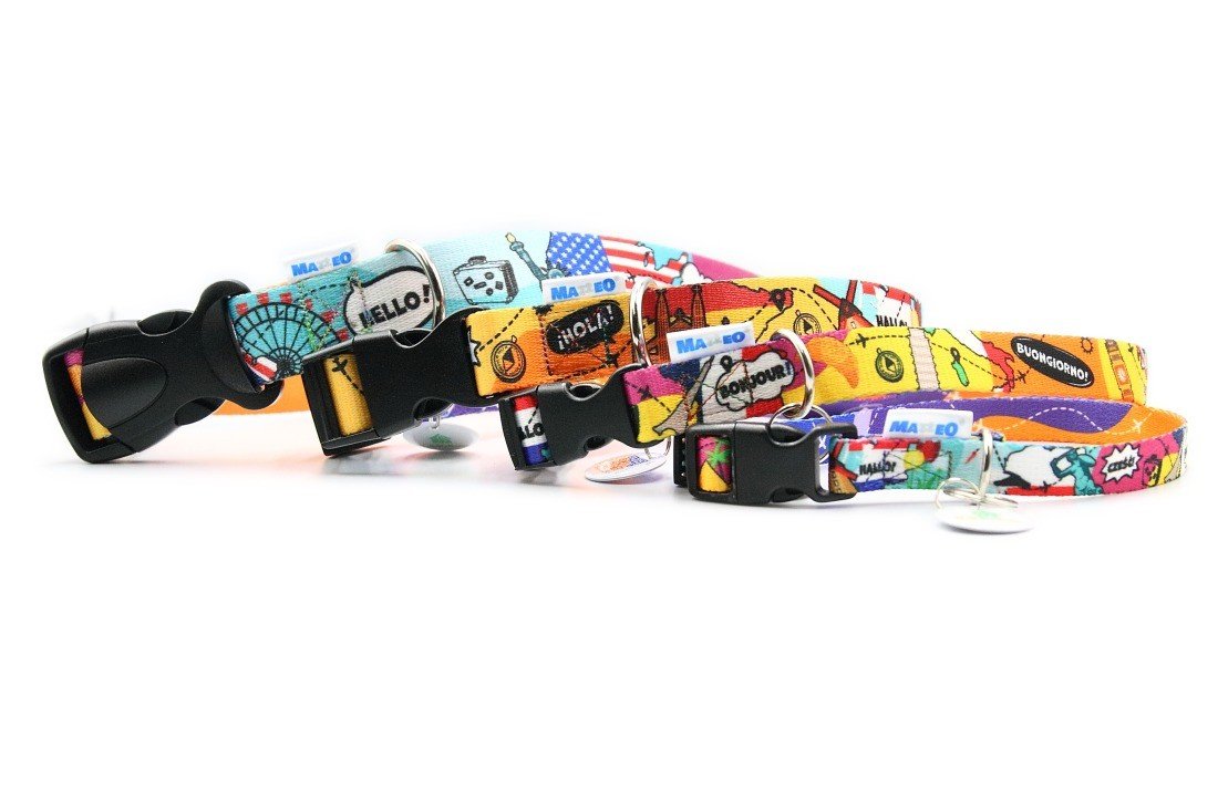 2. Set of colorful travel-themed dog collars with plastic buckles, featuring various global landmarks, on white background