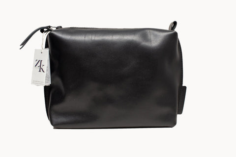 4. Studio shot of Zelma Kraft large black leather cosmetic bag with ZK tag, highlighting craftsmanship
