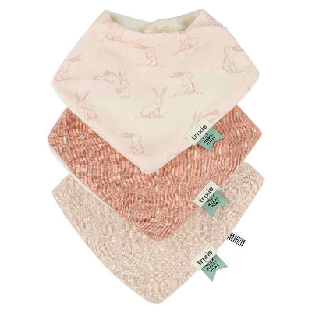 2. Set of three Trixie Baby bandana bibs in pink rabbit print, peach with dots, and beige, displayed in a stack
