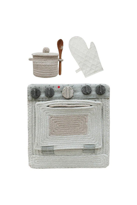 5. Studio shot of Lorena Canals blue sage textile toy stove with pot, spoon, and oven mitt