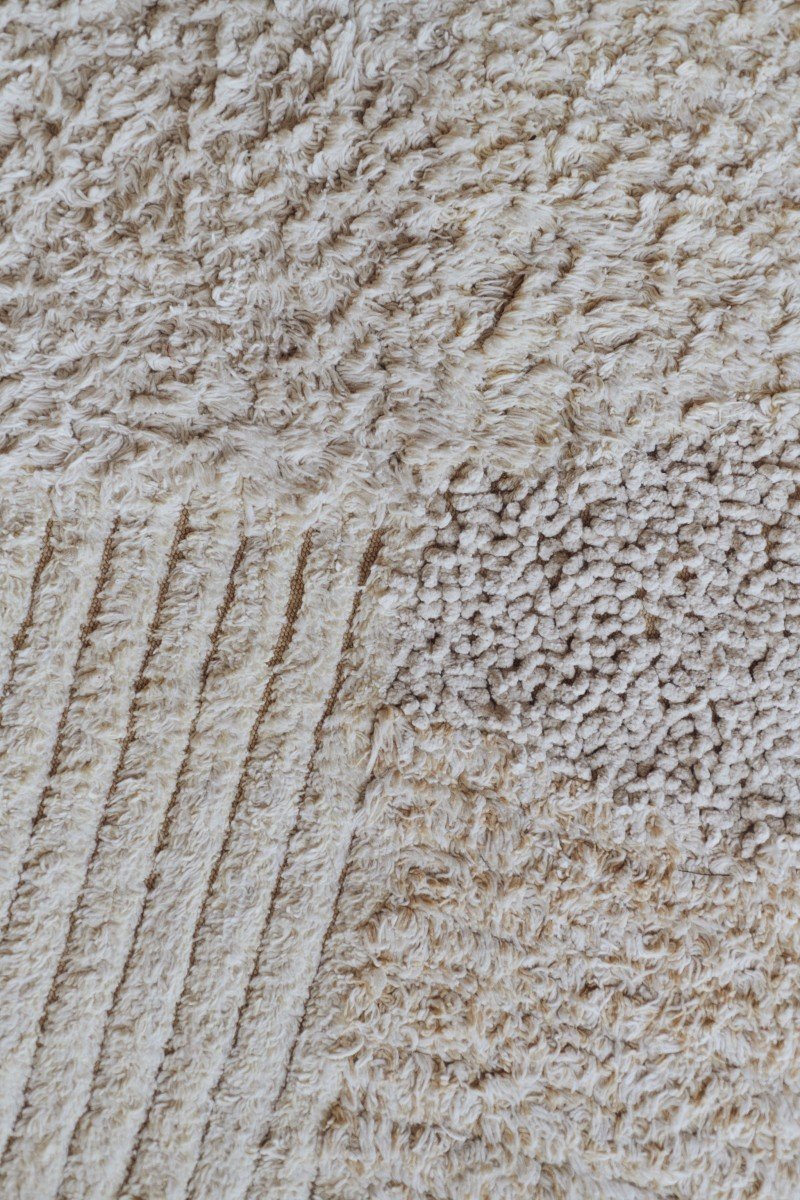 3. Close-up of Lorena Canals cotton play rug showing textured fabric in natural shades of gray and beige