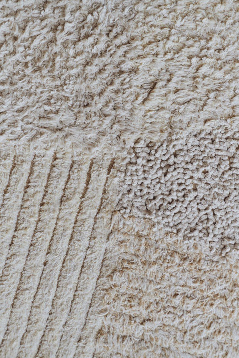 3. Close-up of Lorena Canals cotton play rug showing textured fabric in natural shades of gray and beige