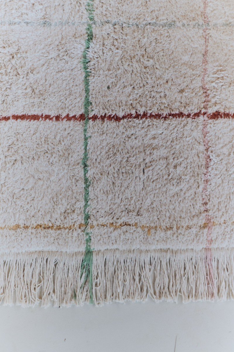 3. Close-up of natural cotton rug showing multicolor stripes and fringe detail