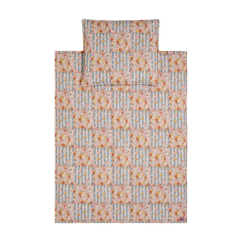 1. Flat lay of Moi Mili cotton quilted patchwork blanket and pillow set in floral and striped pattern