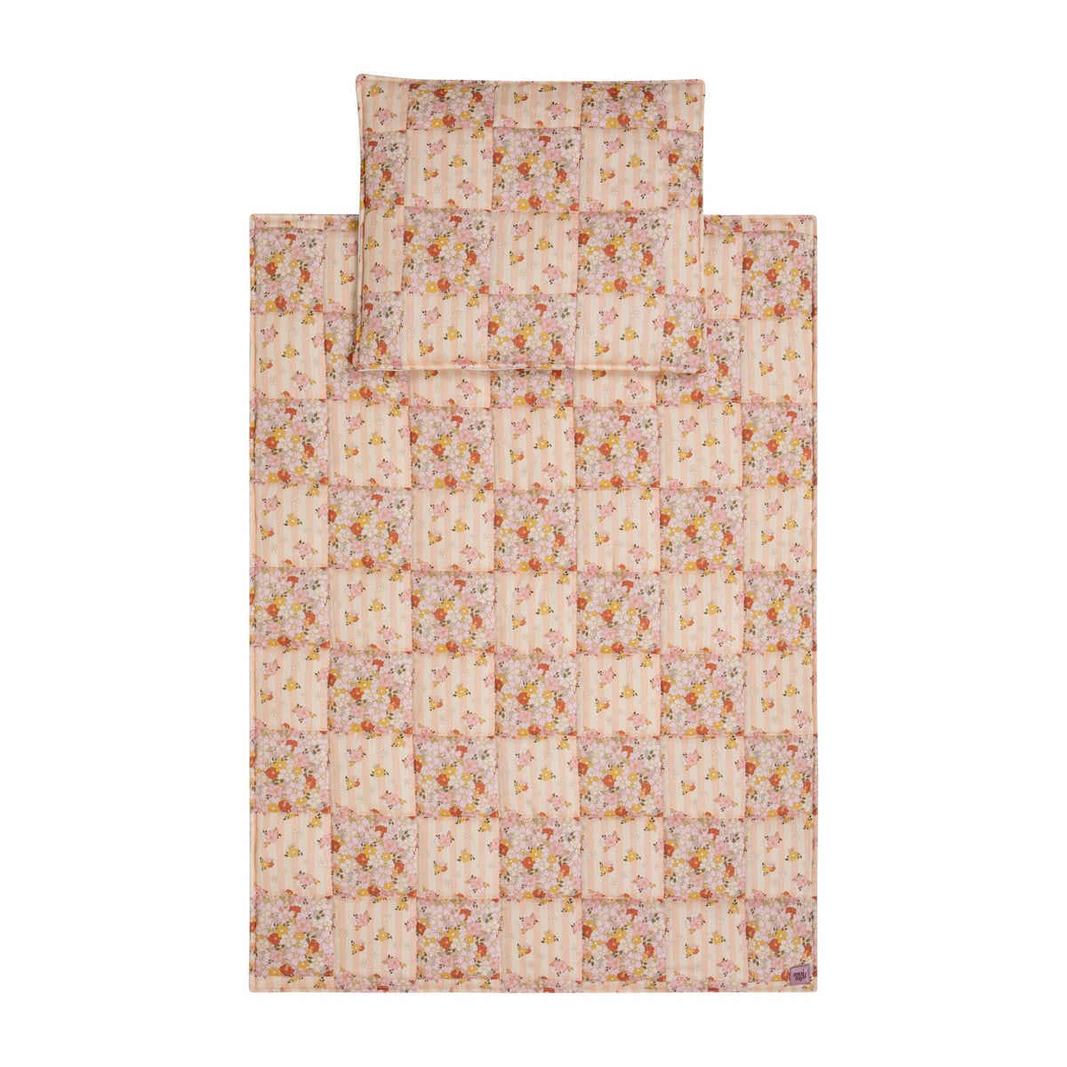 2. Studio shot of cotton quilted patchwork blanket and pillow set in floral pattern