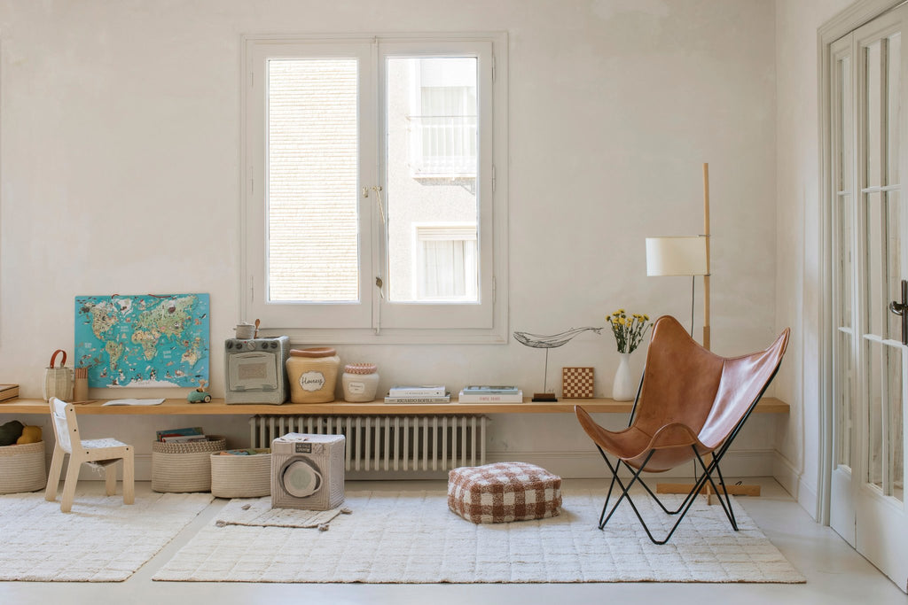 4. Playroom with butterfly chair and Lorena Canals mosaic cotton rug on light floor