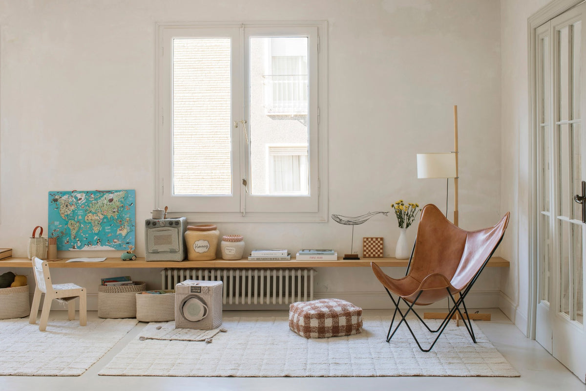 4. Playroom with butterfly chair and Lorena Canals mosaic cotton rug on light floor