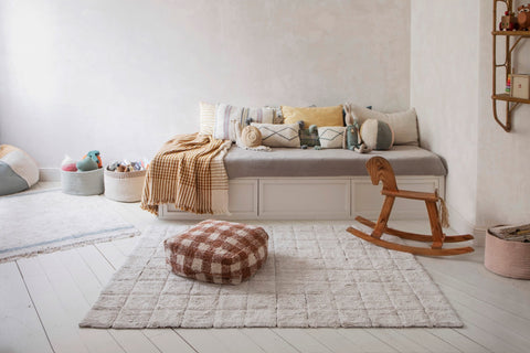 2. Child's room with a daybed and a Lorena Canals toffee-colored mosaic cotton rug on white wooden floor