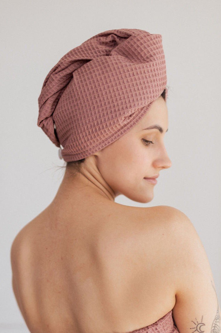 3. Woman in profile wearing pink cotton waffle hair towel turban indoors
