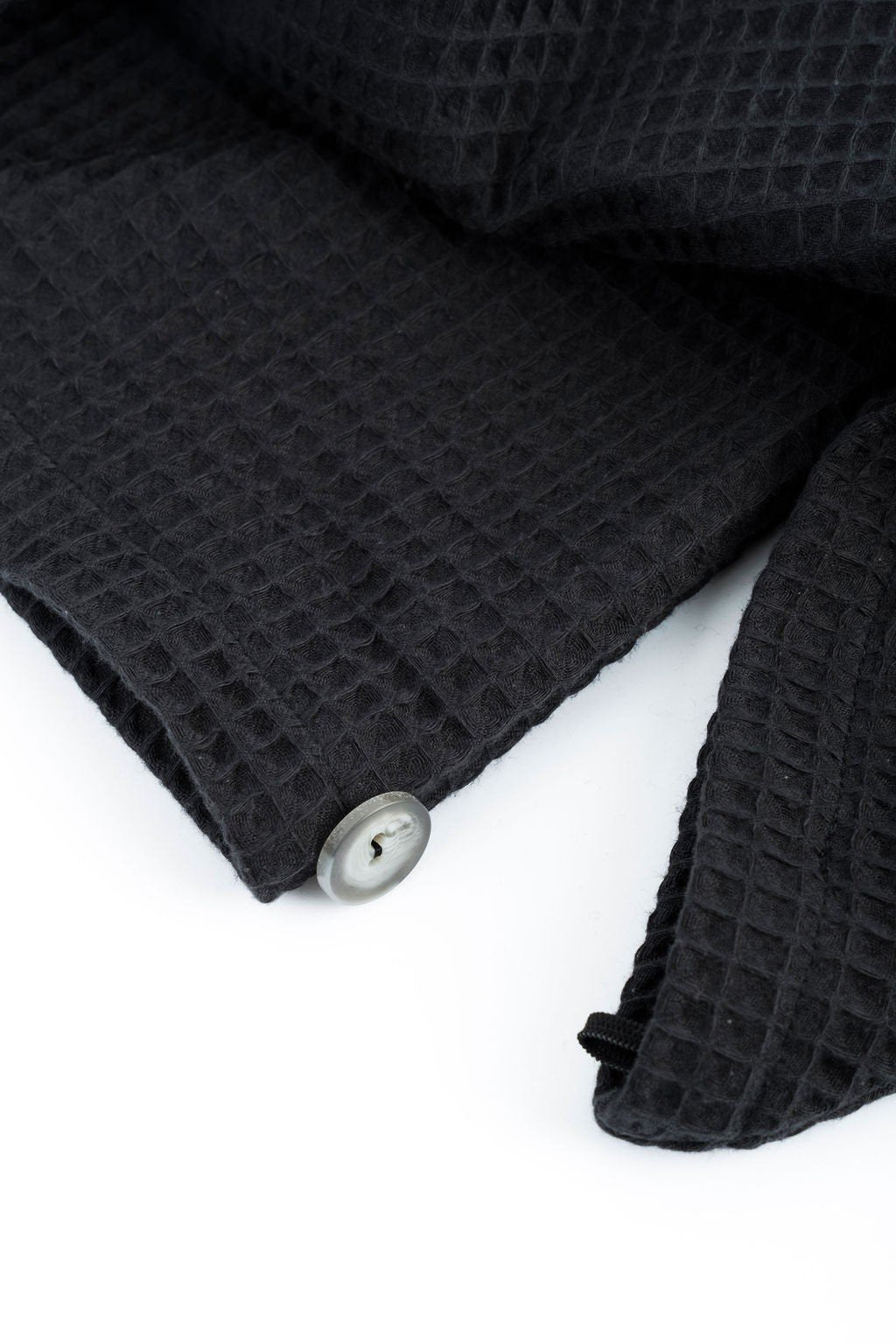15. Close-up of button detail on black cotton waffle hair towel turban
