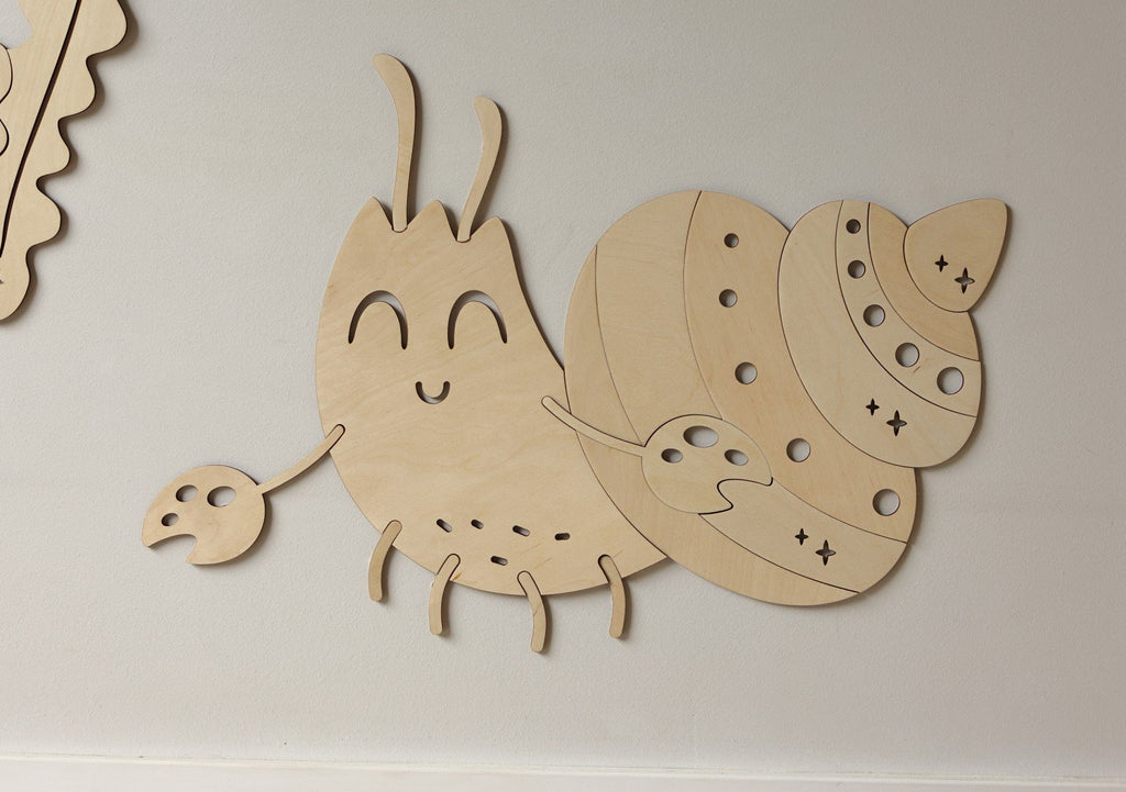 4. Close-up of wooden crab wall decoration with smiling face and detailed shell design