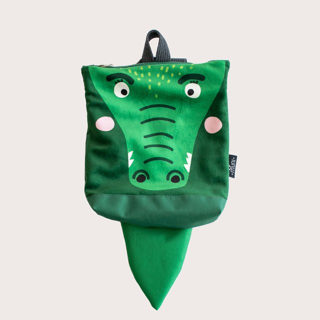 10. Studio image of Muni crocodile backpack showing full design with tail