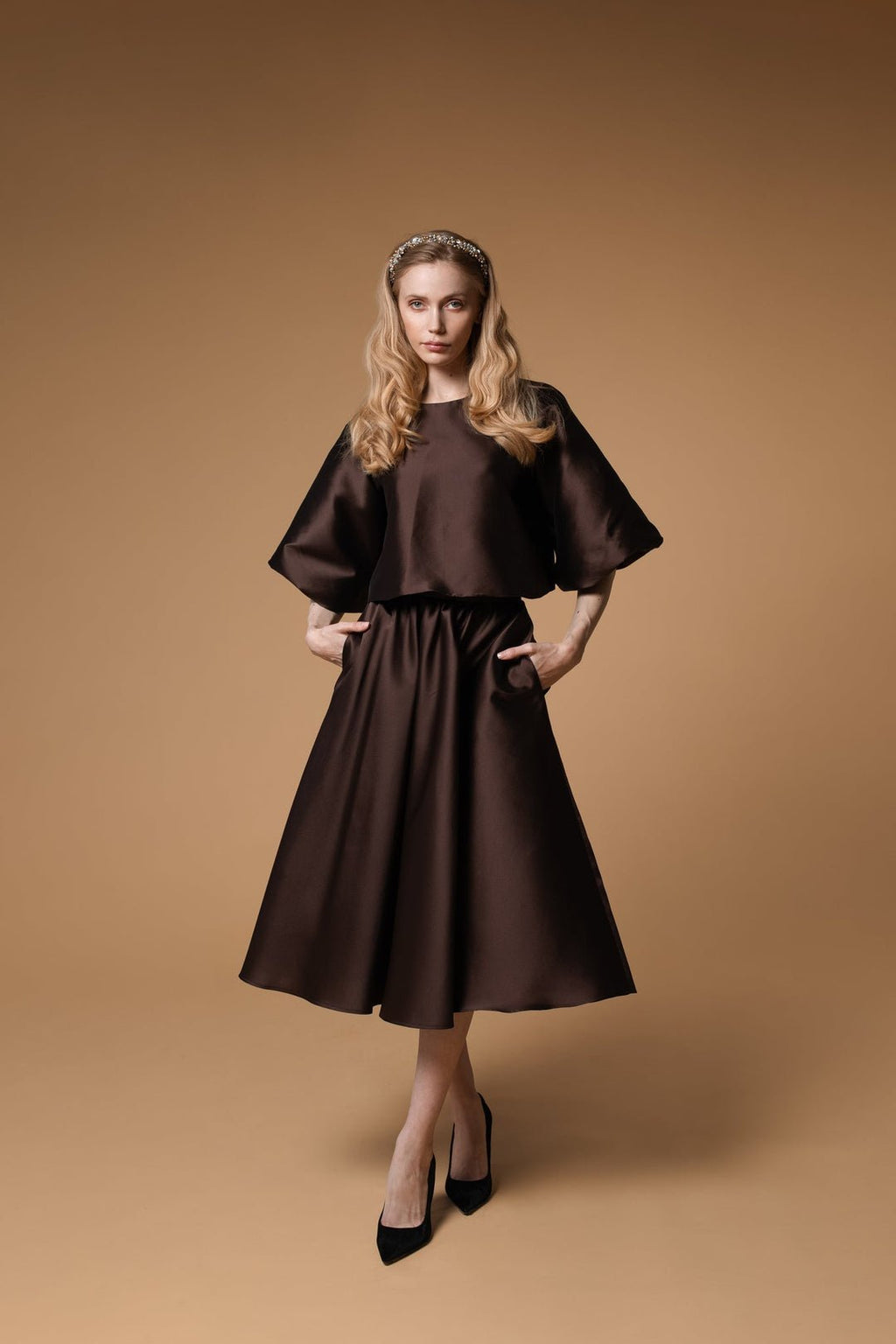 1. Women's Lena headband with crystals and pearls by Eva Oherjus, styled with a brown dress in a lifestyle setting