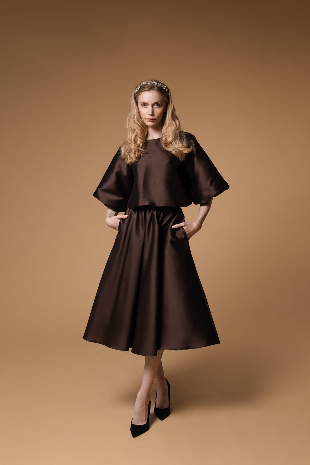 1. Women's Lena headband with crystals and pearls by Eva Oherjus, styled with a brown dress in a lifestyle setting