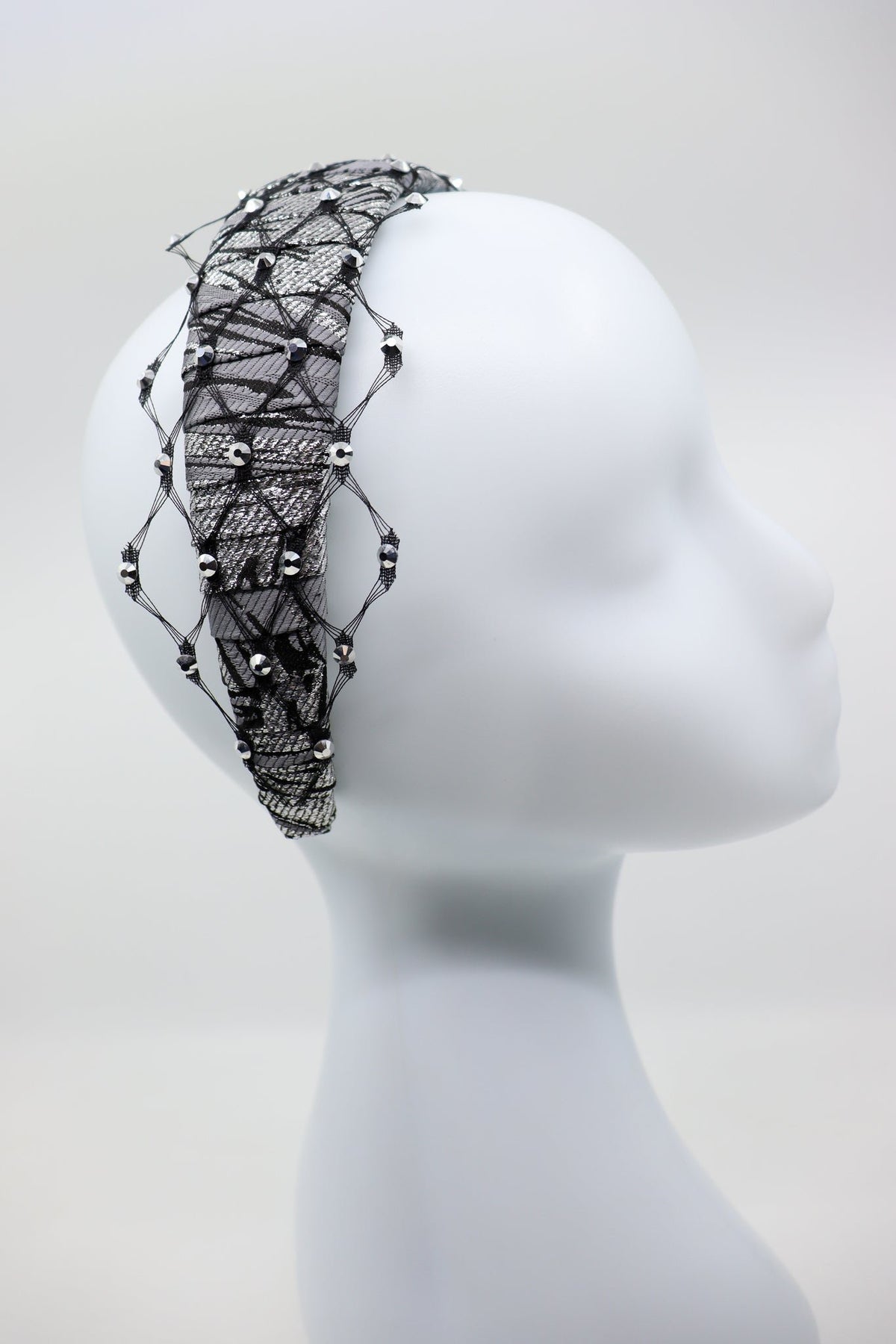 4. Profile view of Fiona headband with honeycomb veil and Swarovski crystals by Eva Oherjus on mannequin