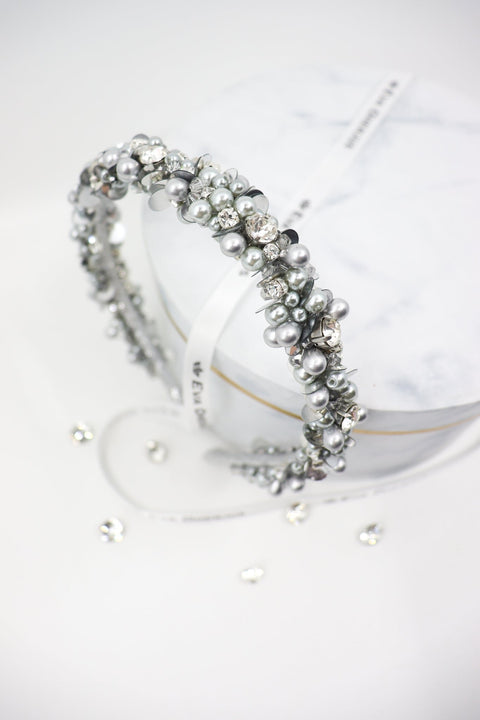 1. Eva Oherjus Selena headband with Swarovski crystals and Preciosa pearls displayed on luxury hat box