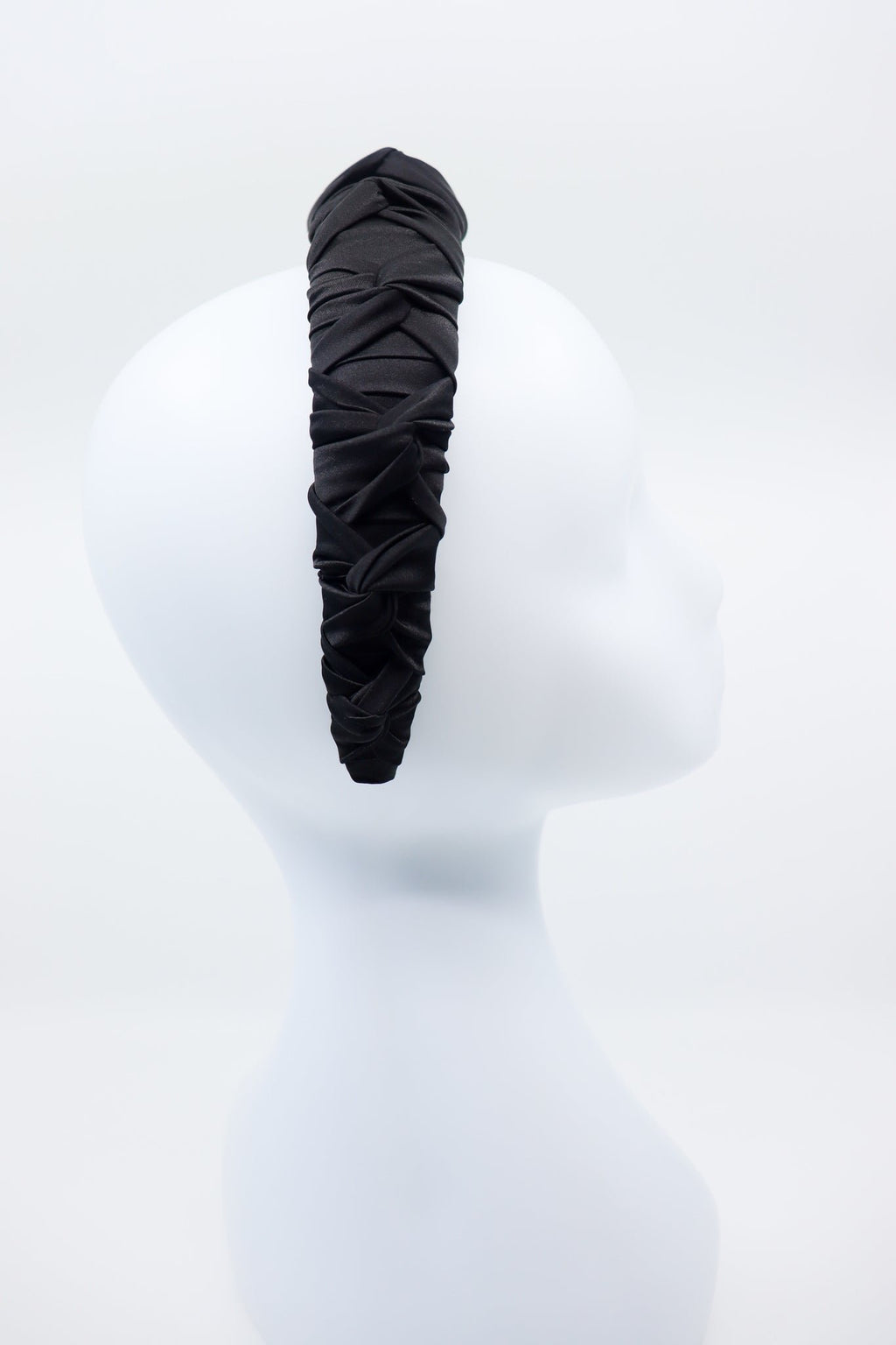 2. Side view of women's black Mulberry silk knotted headband by Eva Oherjus on mannequin