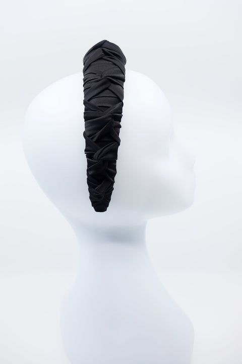 2. Side view of women's black Mulberry silk knotted headband by Eva Oherjus on mannequin