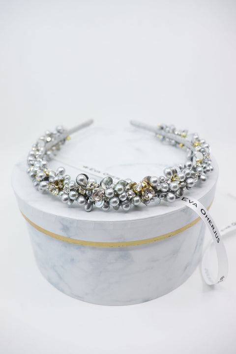 4. Eva Oherjus Selena headband with gold and silver Swarovski crystals on marble hat box