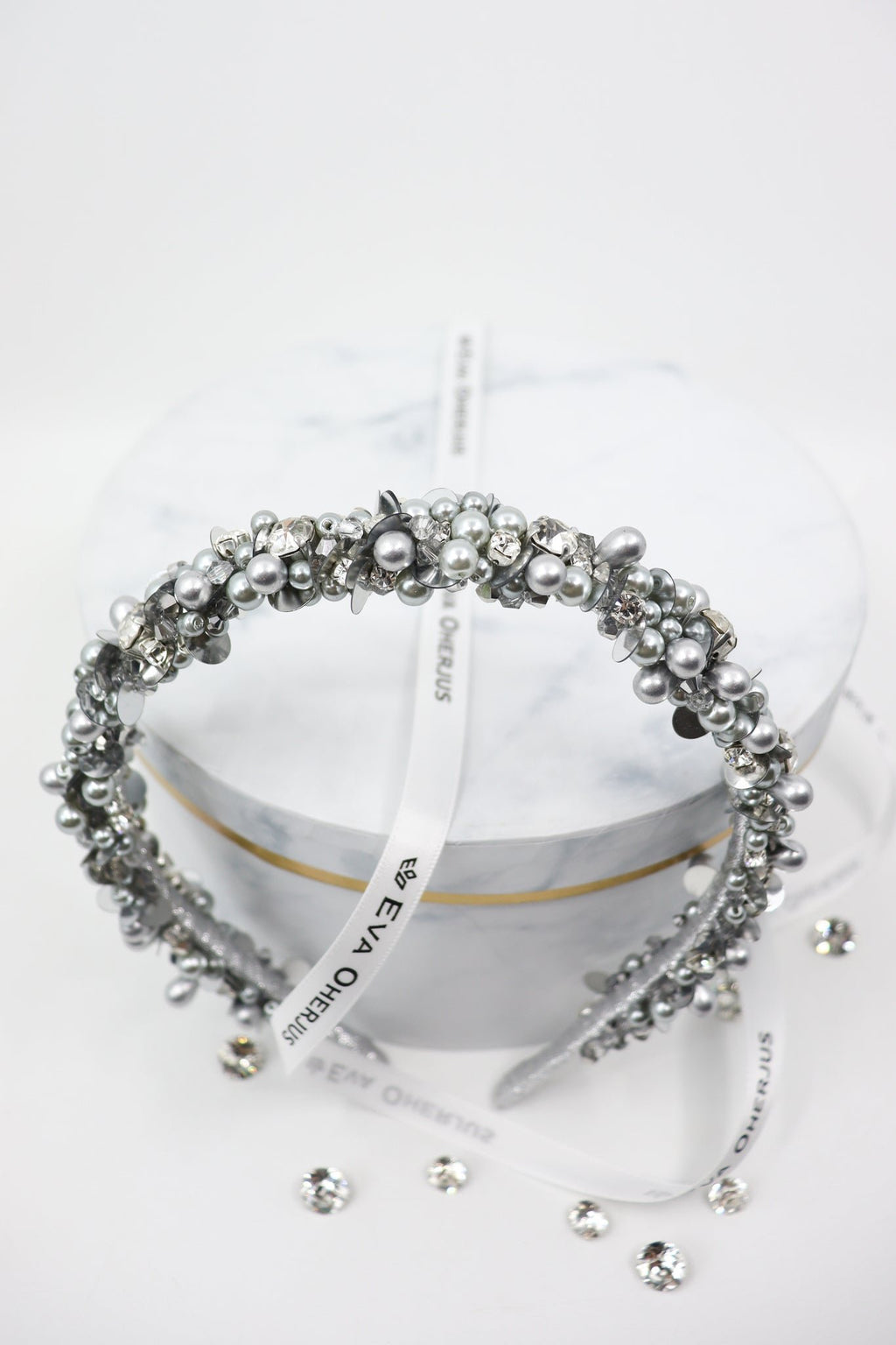 5. Top view of Eva Oherjus Selena headband with Swarovski crystals and pearls on hat box