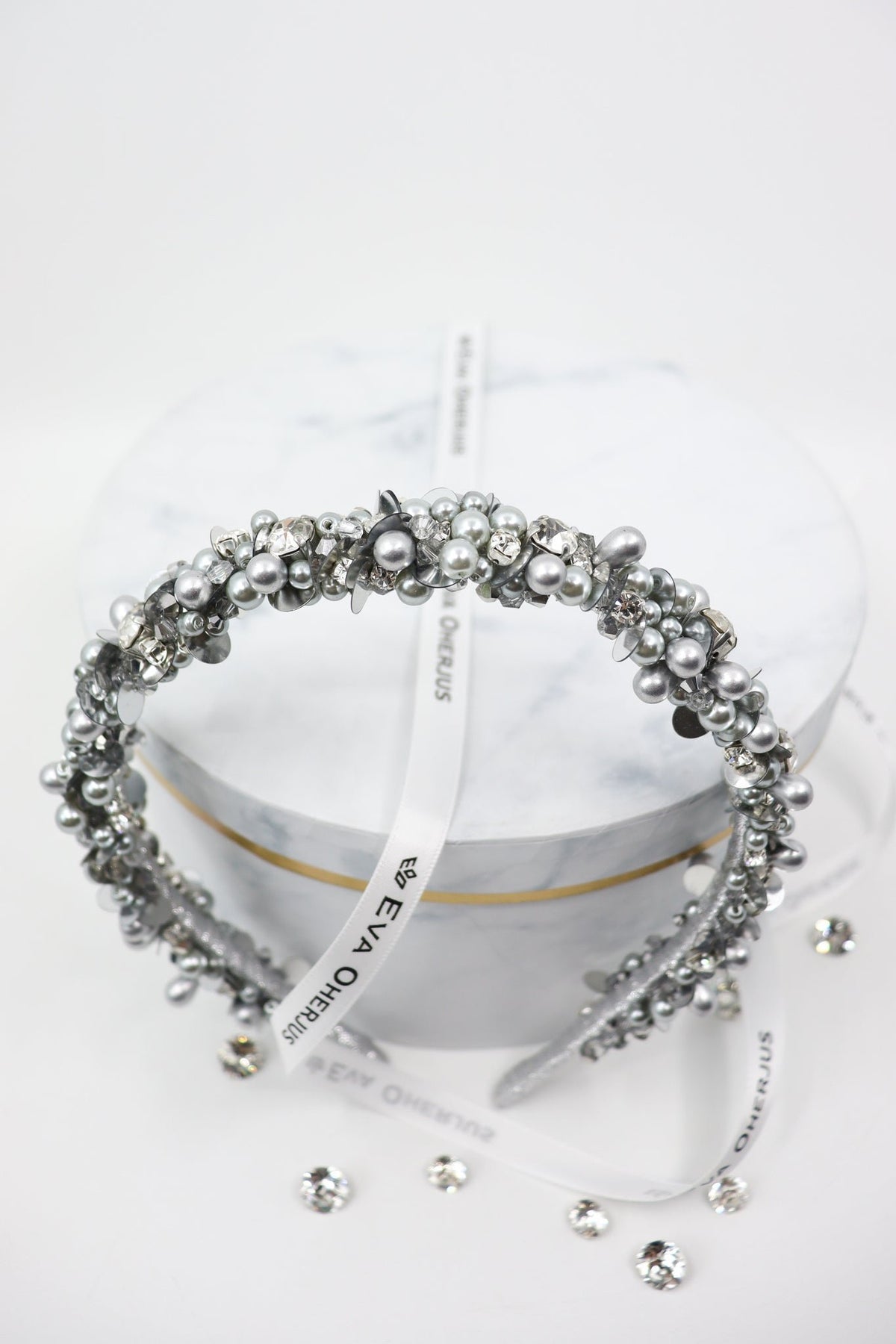 5. Top view of Eva Oherjus Selena headband with Swarovski crystals and pearls on hat box