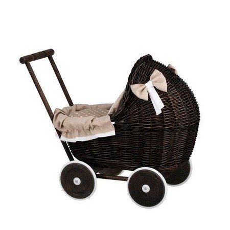 4. Side view of dark painted wicker doll pram with beige bedding and bows, studio setting