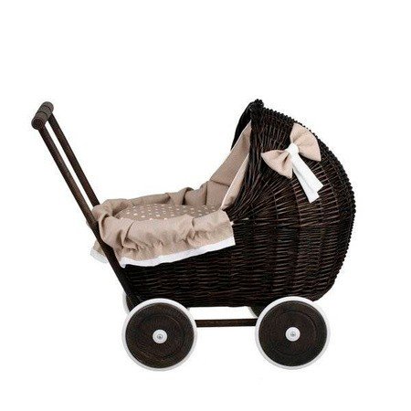 11. Side view of dark painted wicker doll pram with beige bedding and decorative bow, studio setting