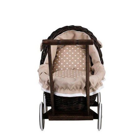 10. Front view of dark painted wicker doll pram with beige polka dot bedding, studio setting