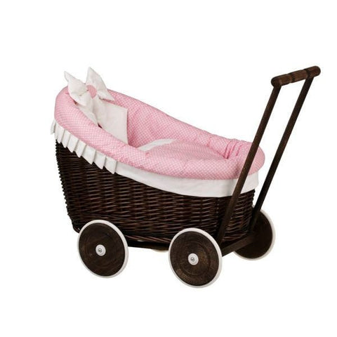 2. Side view of dark painted wicker doll pram with pink bedding and wooden handle