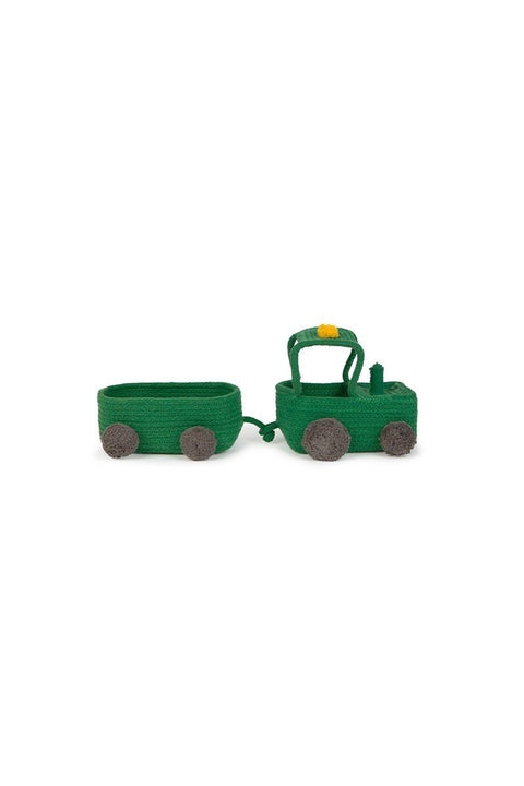 2. Studio shot of green cotton tractor basket with detachable trailer and black pompom wheels on white background