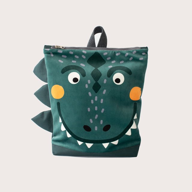 9. Front view of Muni dinosaur backpack with fun prehistoric design