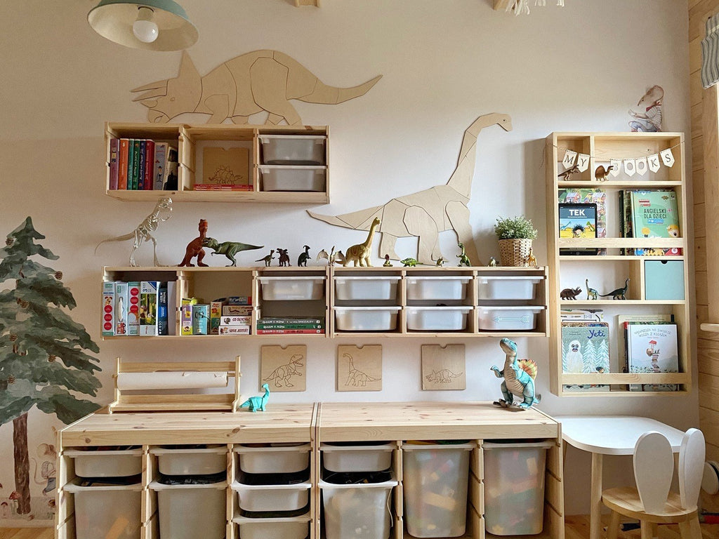 3. Children's room with wooden Triceratops wall decoration above shelves filled with books and dinosaur toys