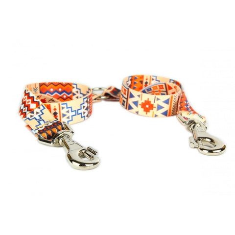 2. Boho style dog leash splitter with colorful geometric patterns and metal clips on white background