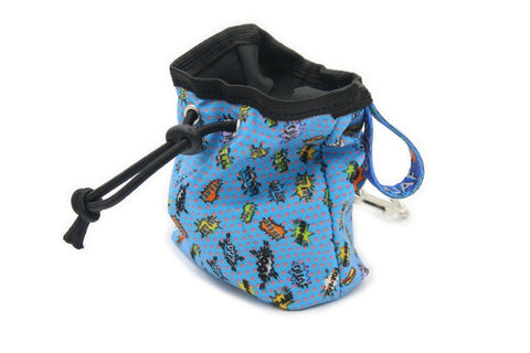 3. Side view of blue graffiti print dog treat bag with black drawstring and colorful strap, studio background