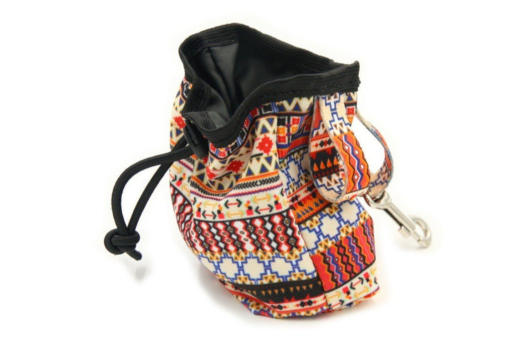 1. Boho-style dog treat bag with colorful geometric print, featuring a drawstring closure and metal carabiner, made from durable oxford and polyester fabric.