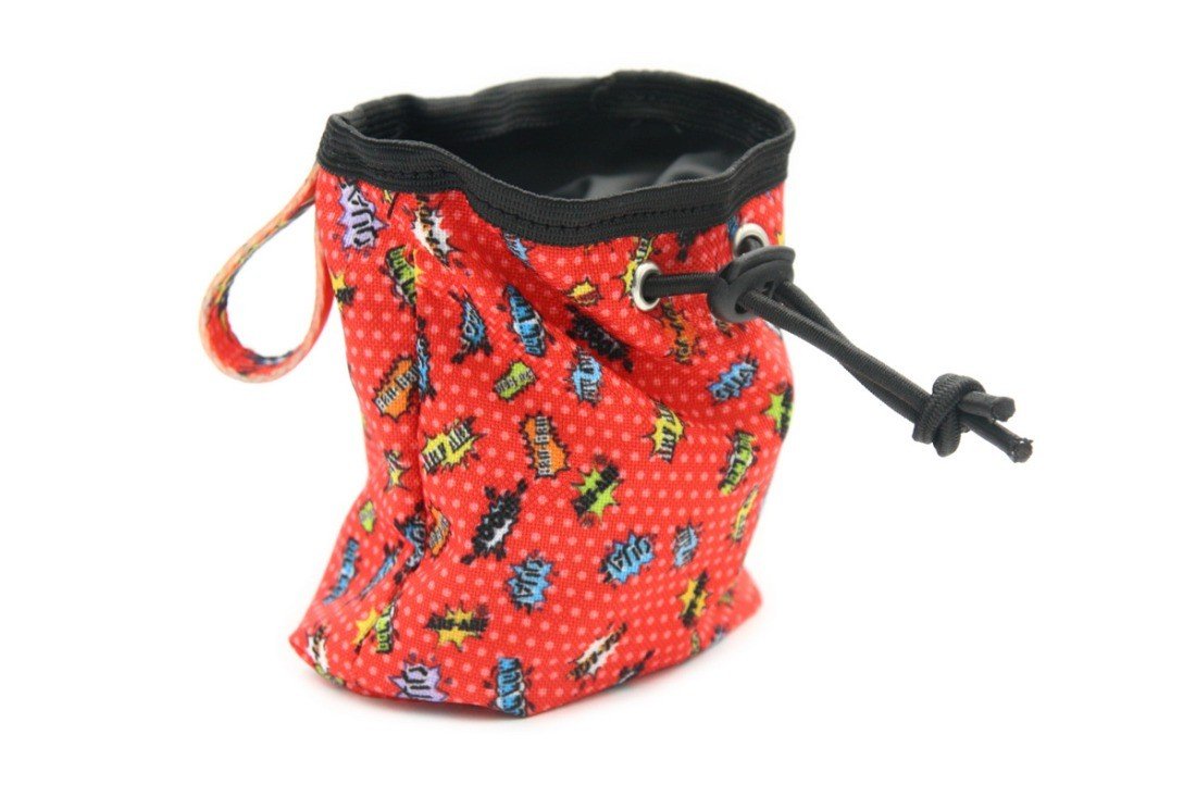 2. Red graffiti print dog treat bag with black drawstring and carabiner, featuring colorful straps, made of durable oxford and polyester fabric, shown in studio setting