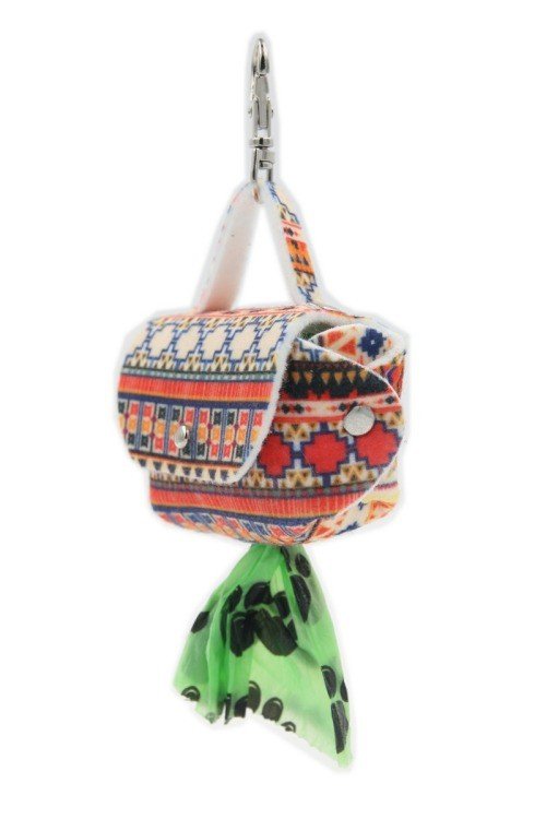4. Boho dog waste bag dispenser with geometric print, green bag emerging from metal eyelet, hanging from snap hook