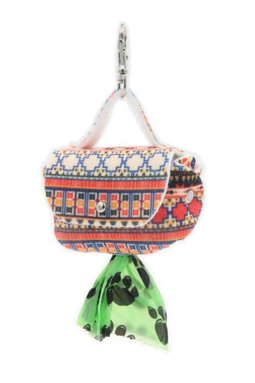 5. Front view of boho dog waste bag dispenser with colorful pattern, green bag visible through metal eyelet, attached by snap hook