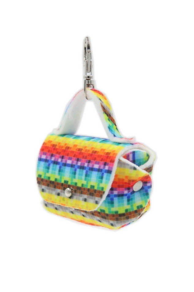 5. Studio shot of dog waste bag dispenser with rainbow pixel design and metal snap hook, shown from a side angle.