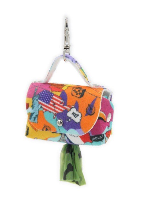 4. Matteo dog waste bag dispenser with colorful motifs, metal eyelet, and green bag protruding
