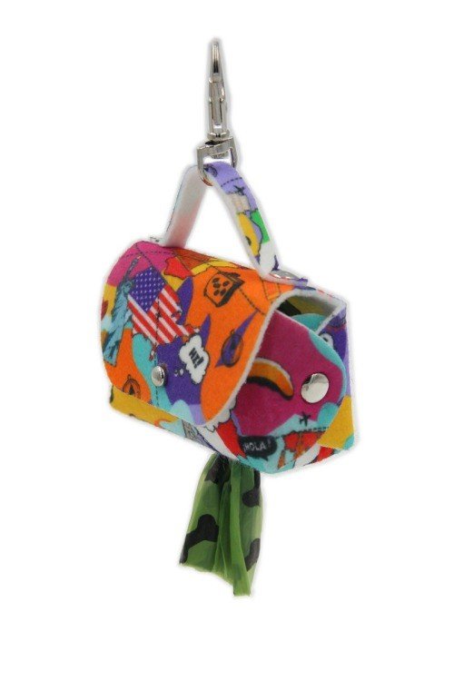 5. Angled view of Matteo dog waste bag dispenser with vibrant print and green bag emerging