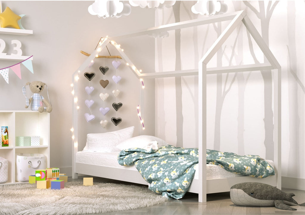 1. Children's room with white house-shaped bed, decorated with heart lights and toys, creating a playful and cozy atmosphere