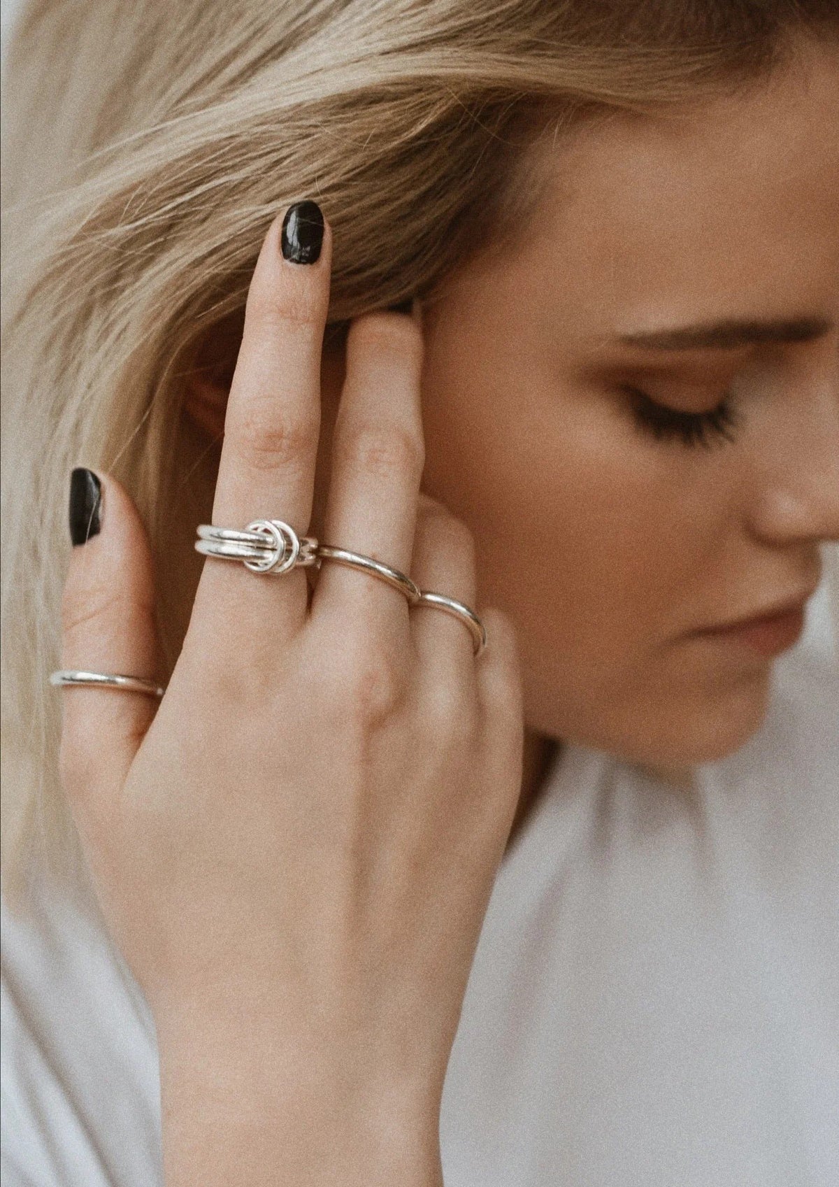2. Close-up of woman wearing NO MORE double ring in silver, showcasing elegant design