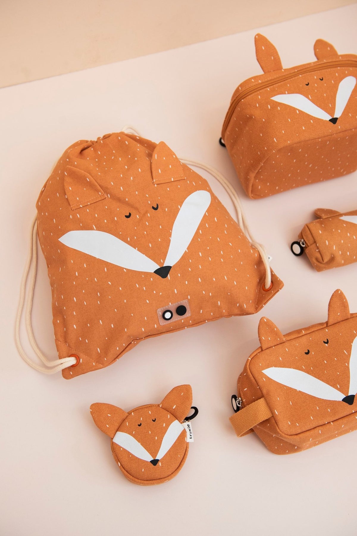 3. Collection of Trixie Baby Mr. Fox products including drawstring bag and pouches with fox face design on orange fabric