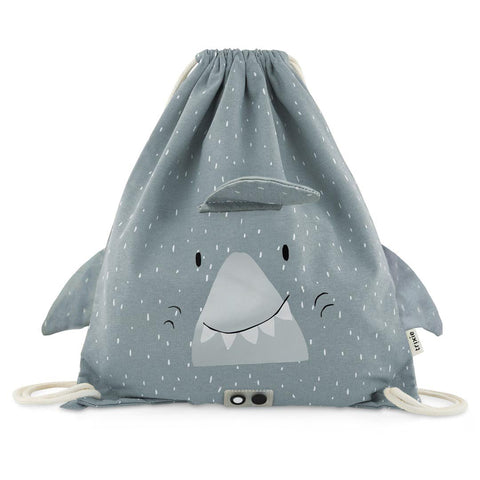 1. Trixie Baby Mr. Shark drawstring bag in grey with playful shark face and floppy ears, featuring white drawstrings and small pocket, made from recycled cotton and viscose, ideal for children aged 3 and up.