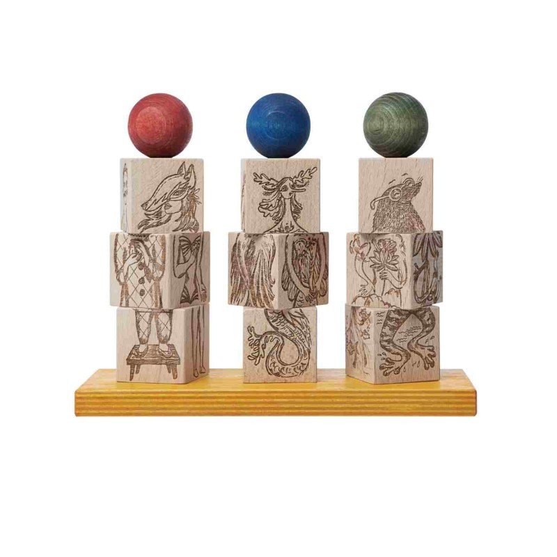2. Wooden Story Dreamland Spinner Puzzle with stacked engraved blocks and colorful spheres on a wooden base